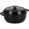 Black cast iron cookware pot with a gold lid knob on a white background